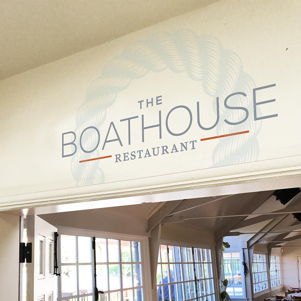 Indoor signage above the entrance to The Boathouse Restaurant