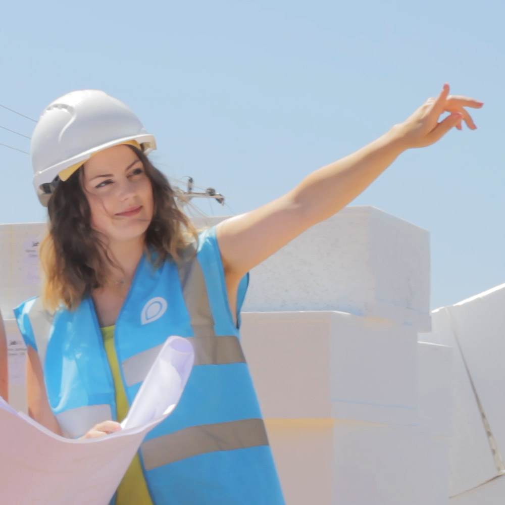 Jess pointing on building site
